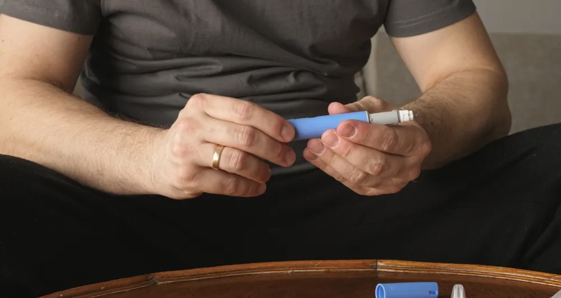 A man is seen with an Ozempic Injection, showcasing his focus on personal care and weight loss.